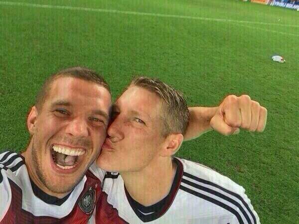 Podolski with Schweinsteiger
