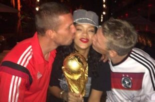 Rihanna holding World Cup trophy with Gotze & Podolski