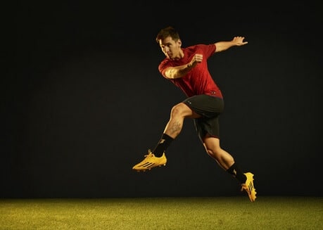 Messi with his new Adidas Adizero Gold Black boots