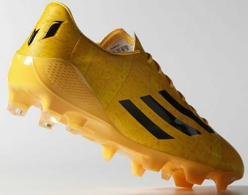 Rear-front view of new golden cleats of Messi