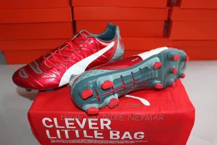 Red color dragon soccer cleats of Puma